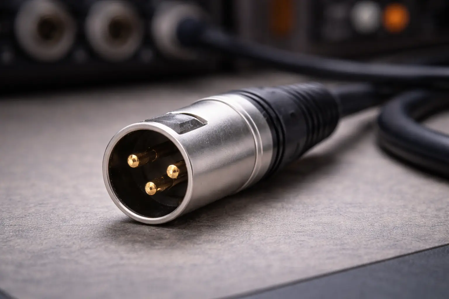 Close up view of three pin XLR connector used for balanced audio.png