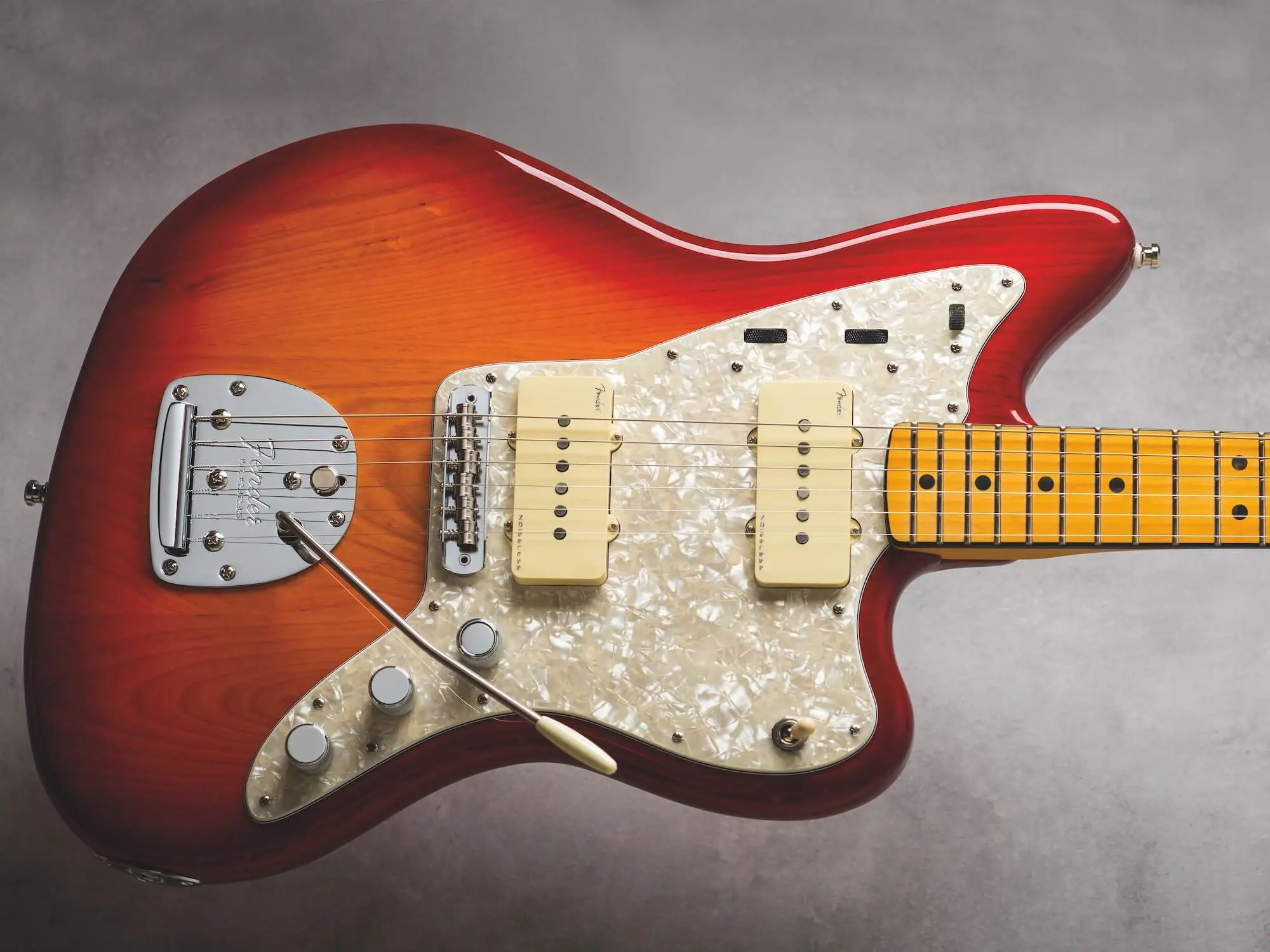 “Offset Jazzmaster guitar leaning and slightly rotating on a generic stand, showing instability issues.”.jpg